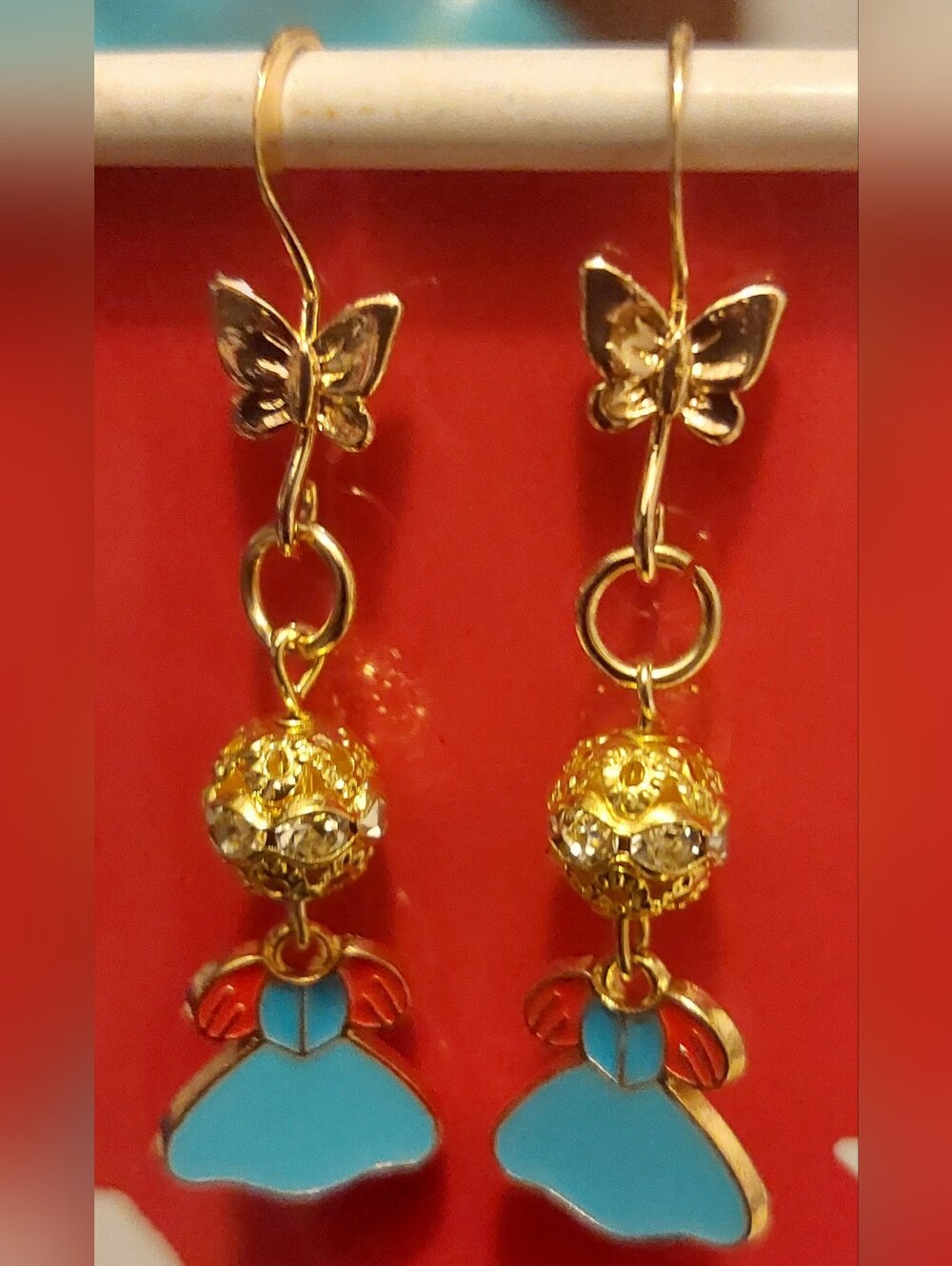 Gold Butterfly Drop Earrings with Turquoise and Red Enamel Accents